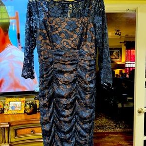 Very nice blue lace over tan dressy dress.  In like new condition.